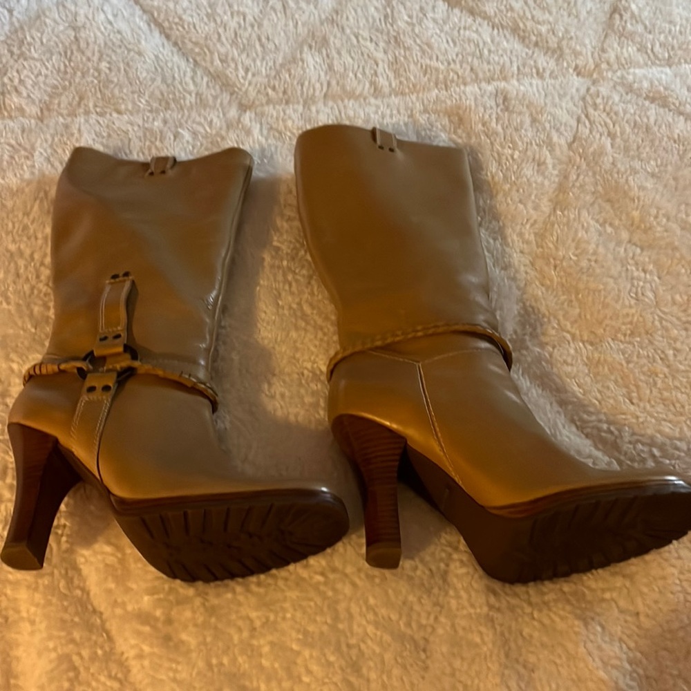 Camel colored high heeled leather boot.